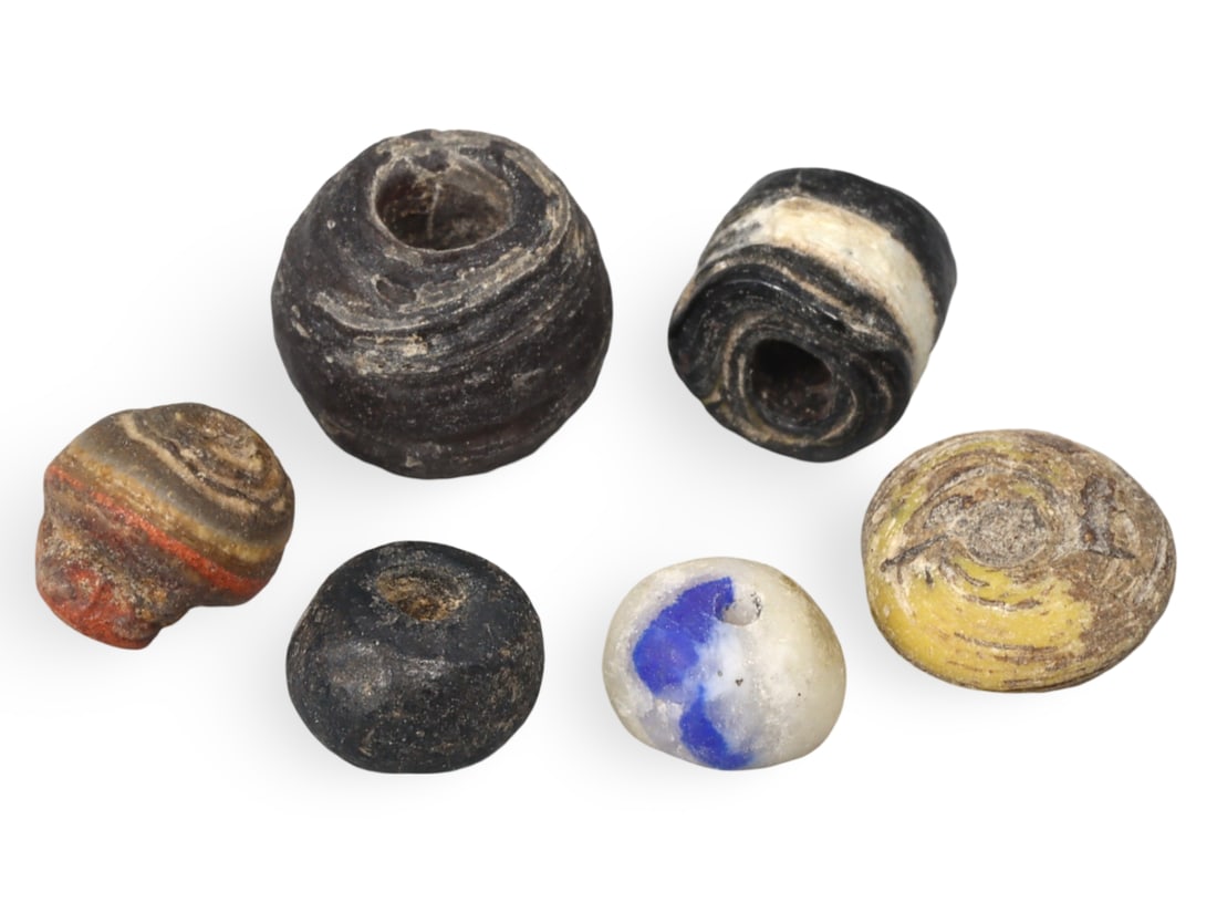 Lot of Ancient Anatolian Archeological Findings Beads, 4000-2000 BCE: This lot consists of various beads excavated from ancient Anatolia, dating back to the period between 4000-2000 BCE. The collection includes beads made from different materials such as stone, bone, an