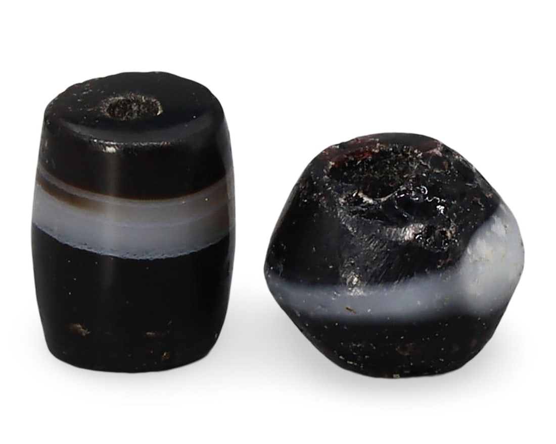 Ancient Indus Valley Tiny Agate Beads, 3rd Millennium BC: These tiny agate beads from the 3rd millennium BC are exquisite artifacts from the Indus Valley civilization. Crafted with meticulous precision, these beads showcase the advanced bead-making technique