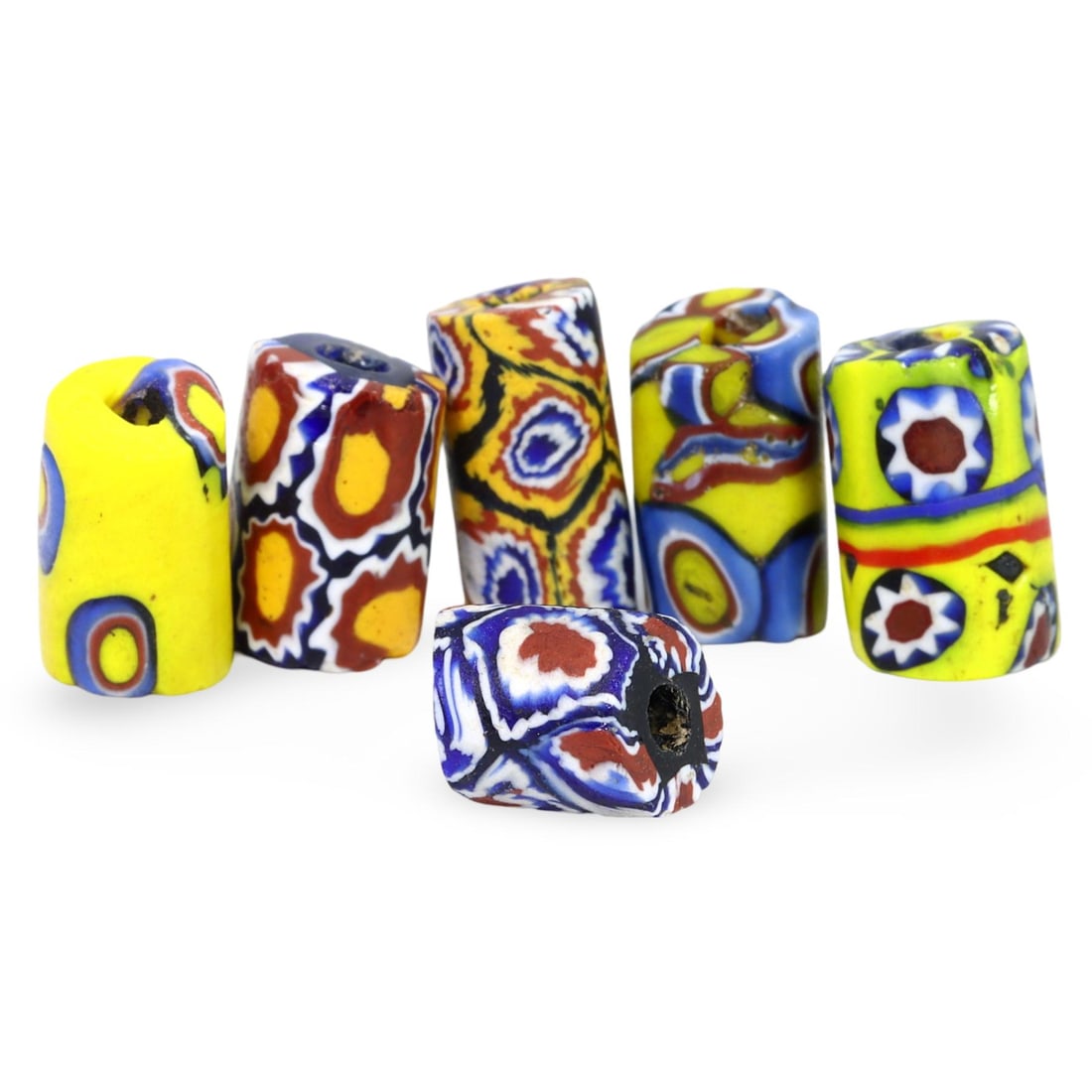 Post Medieval West African Venetian Millefiori Trade Beads, 19th Century: This lot includes a collection of brightly colored and elaborately patterned Venetian millefiori trade beads from the 19th century. Manufactured in Venice, these beads were crafted using the intricate