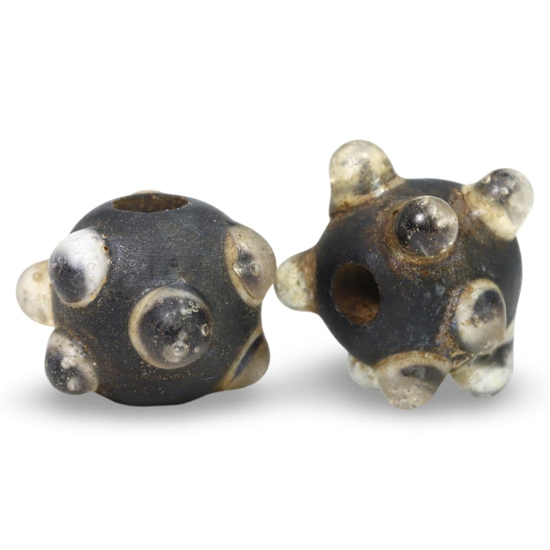 Ancient Late Medieval Sino-Mongolian Stratified Glass Beads, 14th-17th Century: These Ancient Late Medieval Sino-Mongolian Stratified Glass Beads, dating from the 14th-17th century, are remarkable examples of medieval glass craftsmanship. Each bead features a stratified design, w