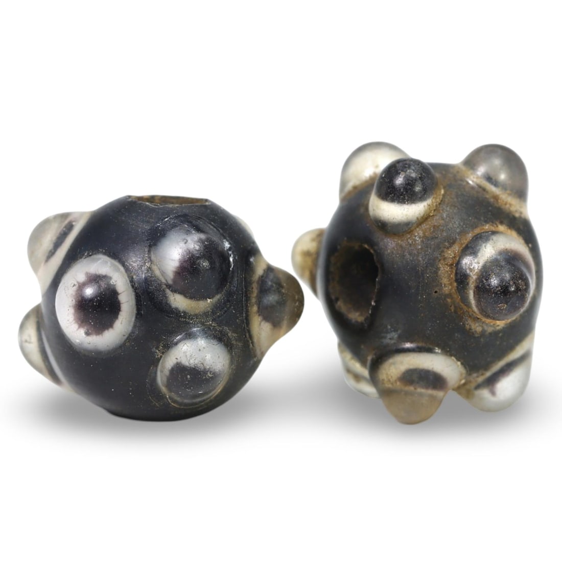 Ancient Late Medieval Sino-Mongolian Stratified Glass Beads, 14th-17th Century: These Ancient Late Medieval Sino-Mongolian Stratified Glass Beads, dating from the 14th-17th century, are remarkable examples of medieval glass craftsmanship. Each bead features a stratified design, w