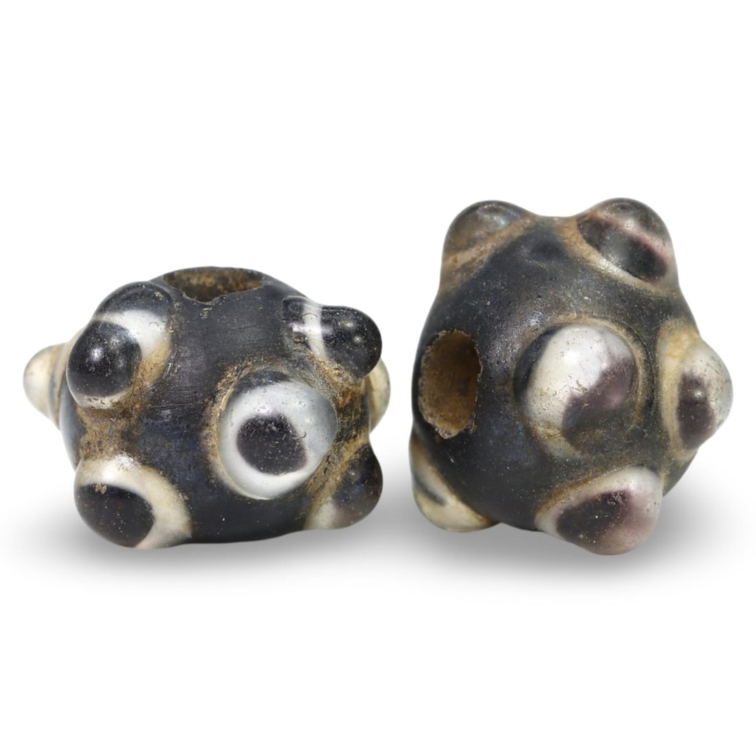 Ancient Late Medieval Sino-Mongolian Stratified Glass Beads, 14th-17th Century: These Ancient Late Medieval Sino-Mongolian Stratified Glass Beads, dating from the 14th-17th century, are remarkable examples of medieval glass craftsmanship. Each bead features a stratified design, w