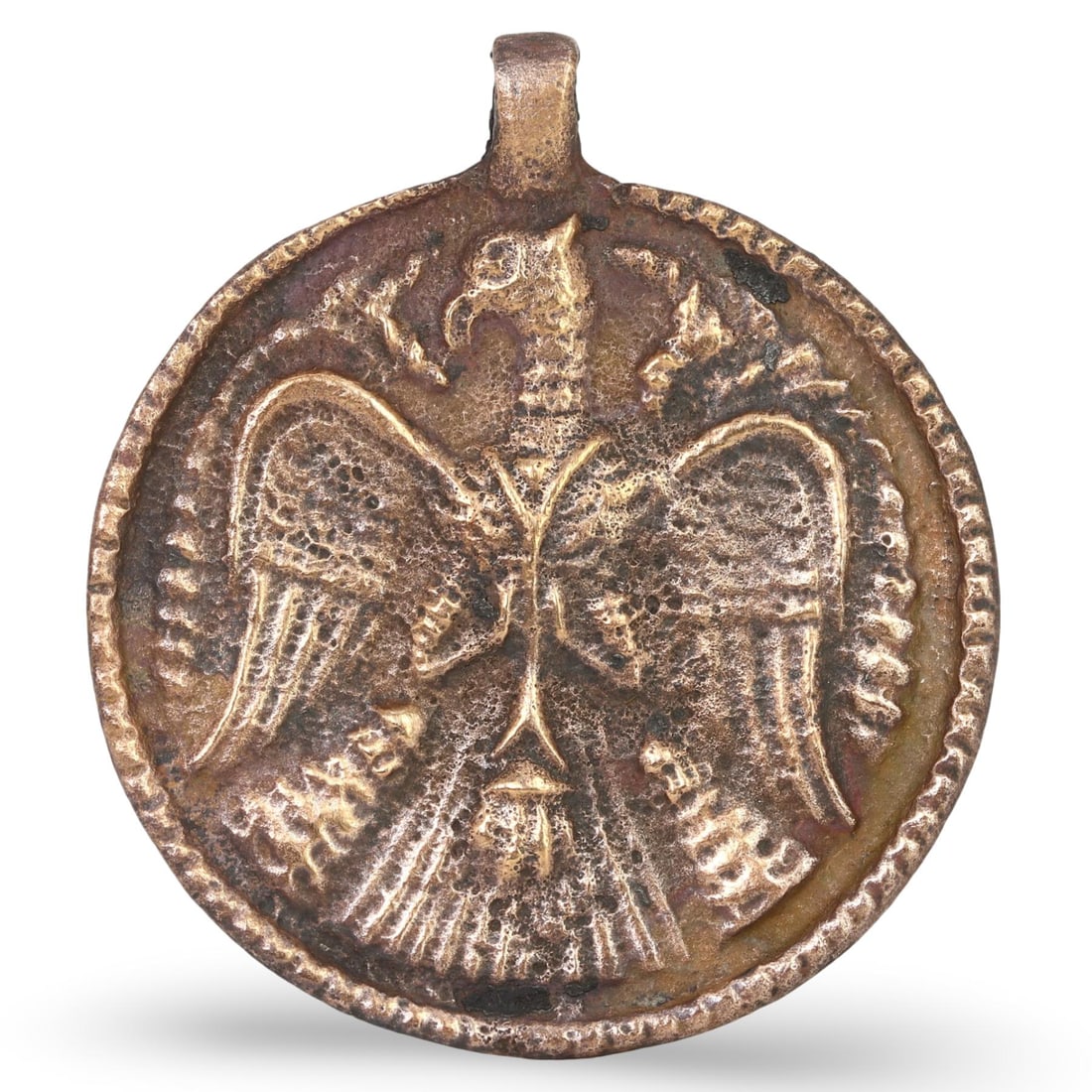 Post Medieval Indo-Scythian Bronze Medallion Amulet, 16th-19th Century: This Bronze Medallion Amulet from the Post Medieval Indo-Scythian period dates back to between the 16th and 19th centuries. Crafted from bronze, this medallion features an intricately detailed design 