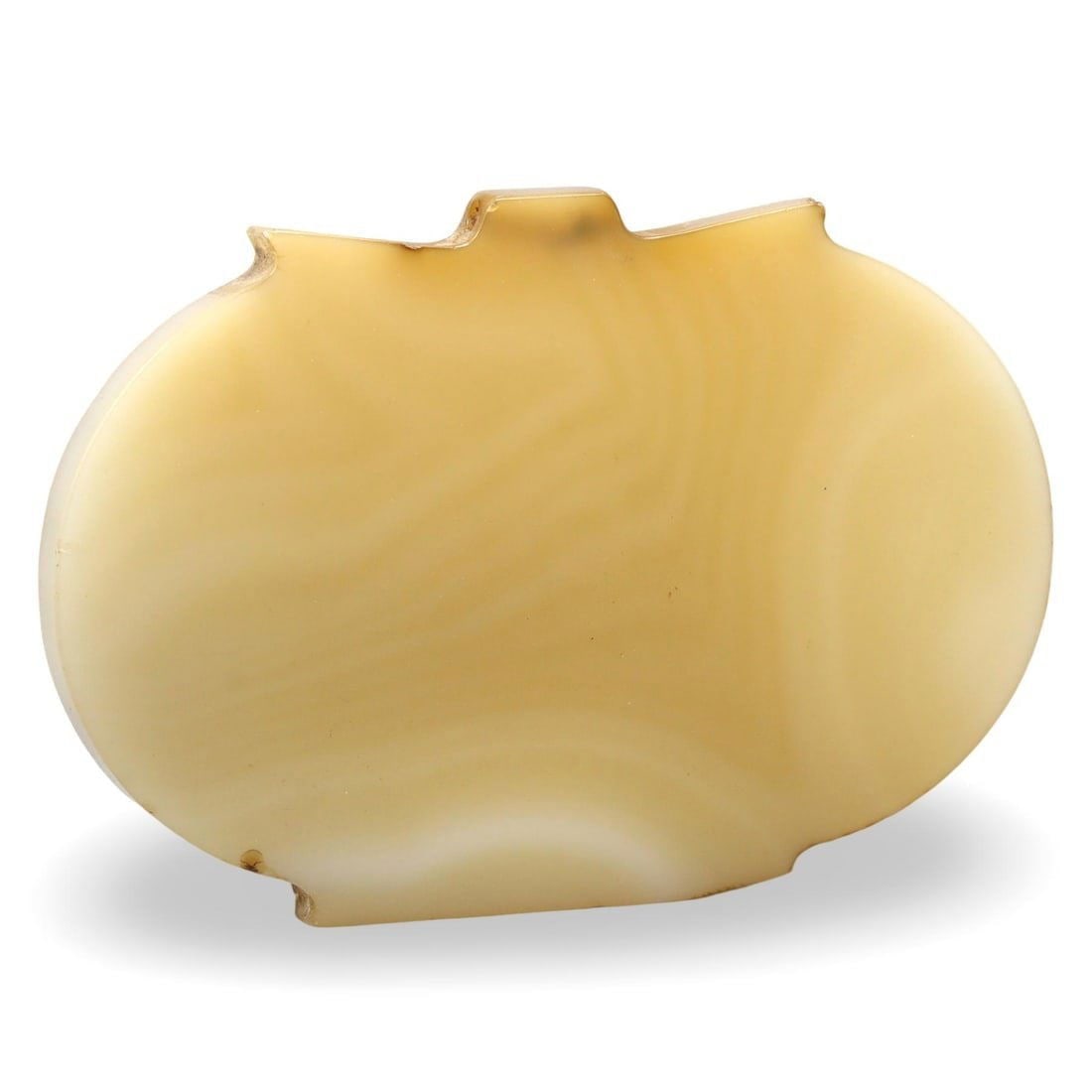 Post Medieval Ottoman Dynasty Carved Agate Amulet, 18th-19th Century: This Post Medieval amulet from the Ottoman Dynasty is masterfully carved from natural agate, dating back to the 18th-19th centuries. The amulet's smooth surface and delicate coloration reflect the exq