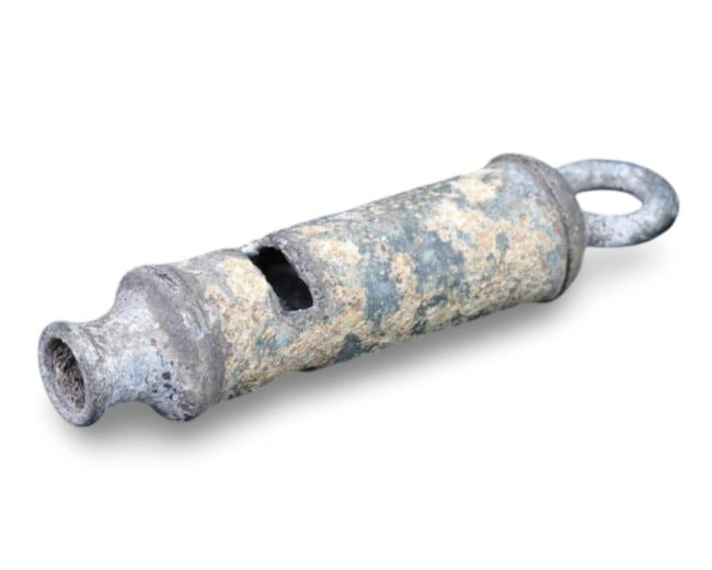 WW1 Military Whistle, Early 20th Century: This WW1 military whistle, dating back to the early 20th century, is a poignant artifact from one of the most significant conflicts in modern history. Used by soldiers and officers on the battlefield,