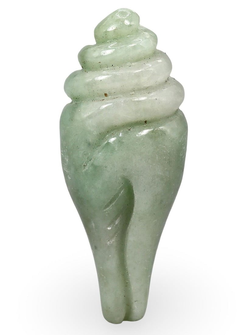 Post Medieval Tibetan-Burmese Jadeite Jade Conch Shell Amulet, 19th-20th Century: This exquisite amulet, crafted from jadeite jade, dates back to the Post Medieval period, specifically between the 19th and 20th centuries. Originating from the Tibetan-Burmese region, the amulet is i