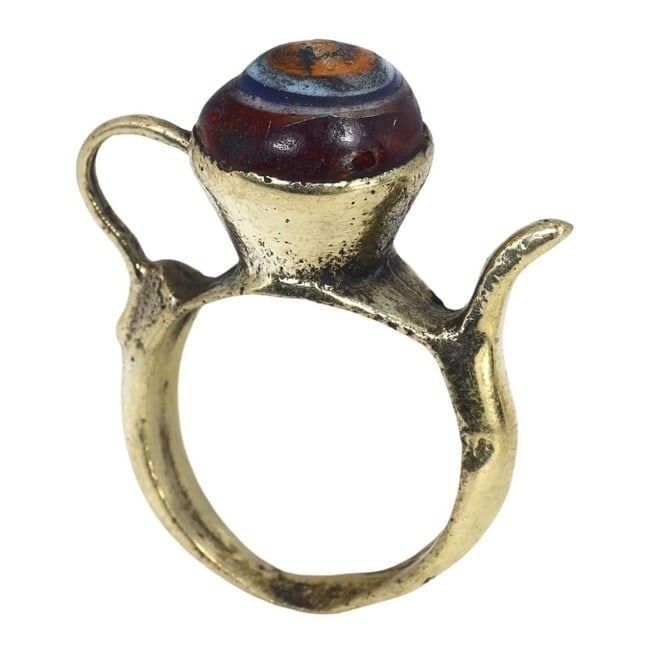 Antique Post Medieval Period Nomadic Ring with Mosaic Glass Bead, US 6.5, 19th Century: This antique ring from the post-medieval period showcases the nomadic artistry of the 19th century. Crafted with a beautiful mosaic glass bead at its center, the ring is designed in a US size 6.5. The