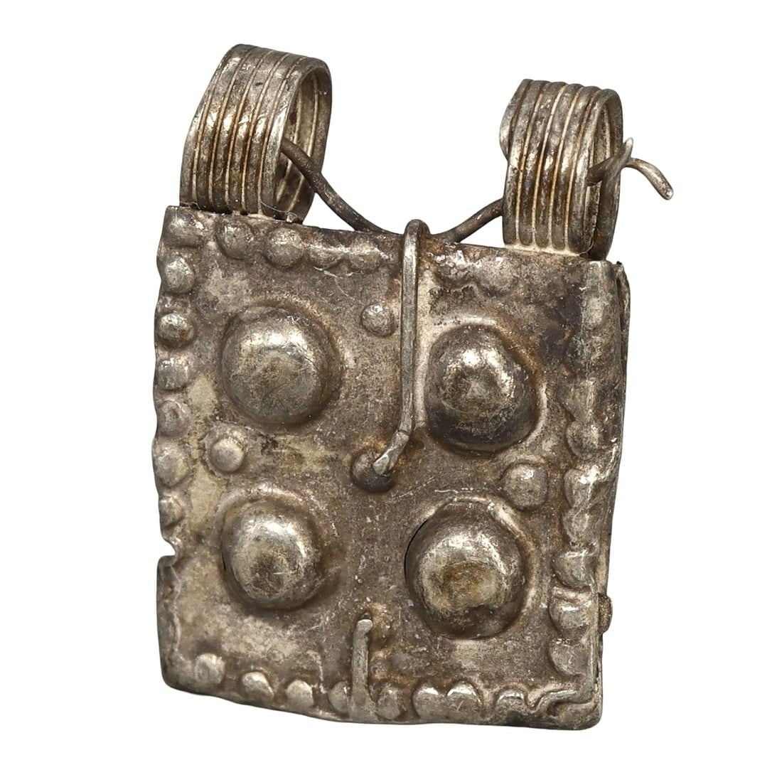 Ancient Medieval Viking / Celtic Silver Pendant Ornament, 9th-11th Century: This silver pendant ornament from the Ancient Medieval period, dating back to the 9th-11th century, is a remarkable example of Viking and Celtic craftsmanship. Such pendants were often used as amulets