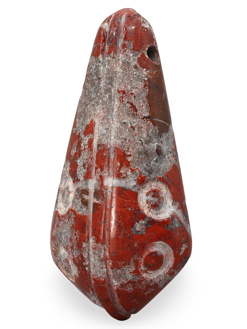 Ancient Middle Medieval Eurasian Steppe Agate Amulet Bead, 11th-13th Century: This Ancient Middle Medieval Eurasian Steppe Amulet Bead, dating back to the 11th-13th century, is expertly carved from semi-precious stone. The bead's distinctive diamond shape and vibrant coloration