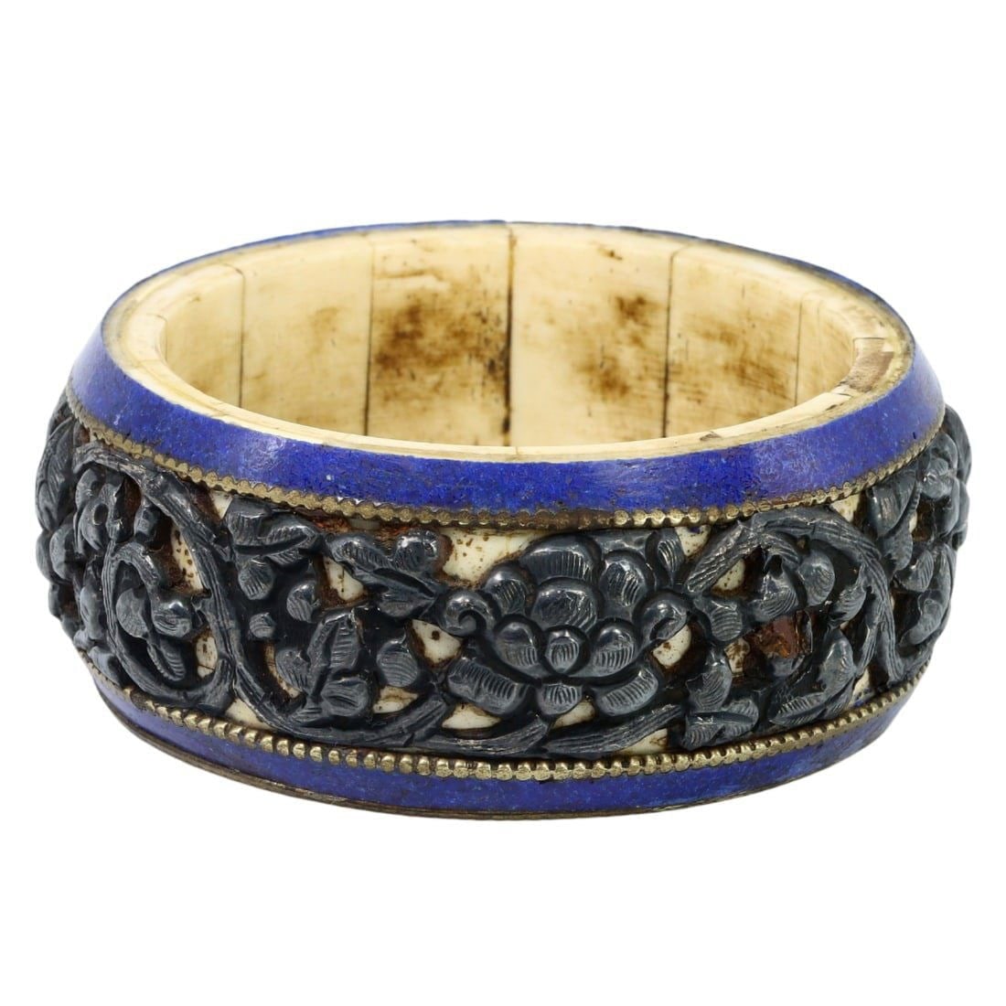 Mid Century Sino-Tibetan Floral Motif Bangle Bracelet with Yak Bone, Mid 20th Century: This mid-century bangle bracelet from the Sino-Tibetan region, dating to the mid 20th century, features a stunning floral motif crafted with intricate detail. The exterior is adorned with beautiful fl