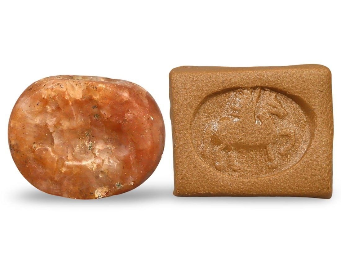 Ancient Archaic Greek Winged Horse Motif Carnelian Stamp Seal, 700-600 BC: This ancient Archaic Greek stamp seal, dating from 700 to 600 BC, showcases a captivating winged horse motif carved into carnelian. Originating from the Cyclades region, known for its rich cultural he