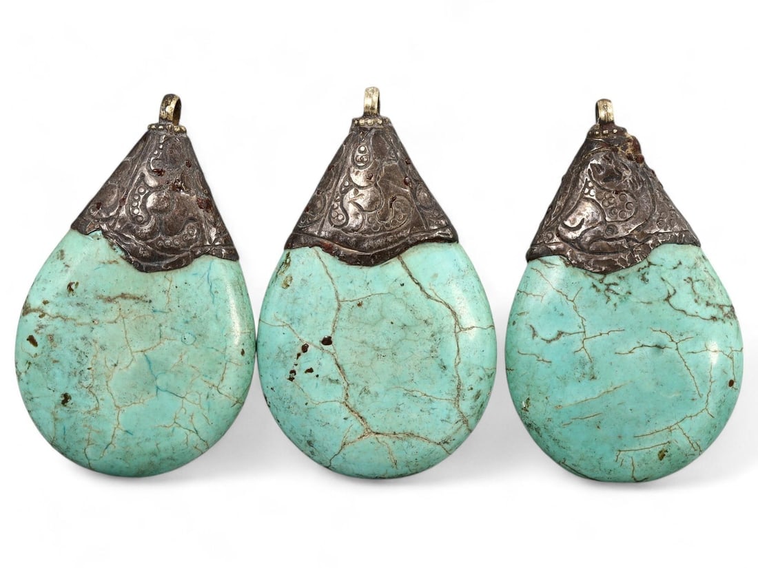 Antique Tibetan Turquoise Howlite Silver-Capped Pendants: We are delighted to present an extraordinary collection of jewelry and artifacts spanning various historic European periods. Our selection ranges from Ancient Roman, Byzantine, and Early Medieval to L