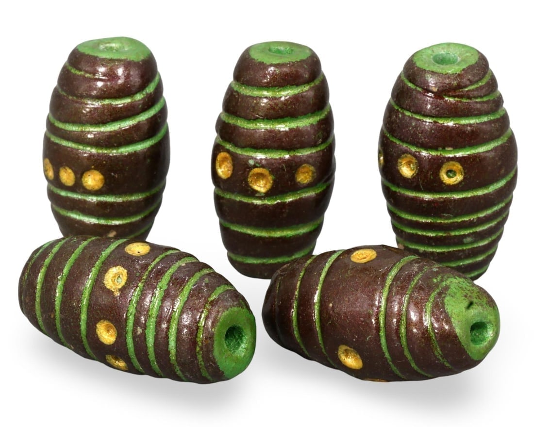 Lot of 5 Antique Green and Yellow Striped African Tribal Beads: We are delighted to present an extraordinary collection of jewelry and artifacts spanning various historic European periods. Our selection ranges from Ancient Roman, Byzantine, and Early Medieval to L