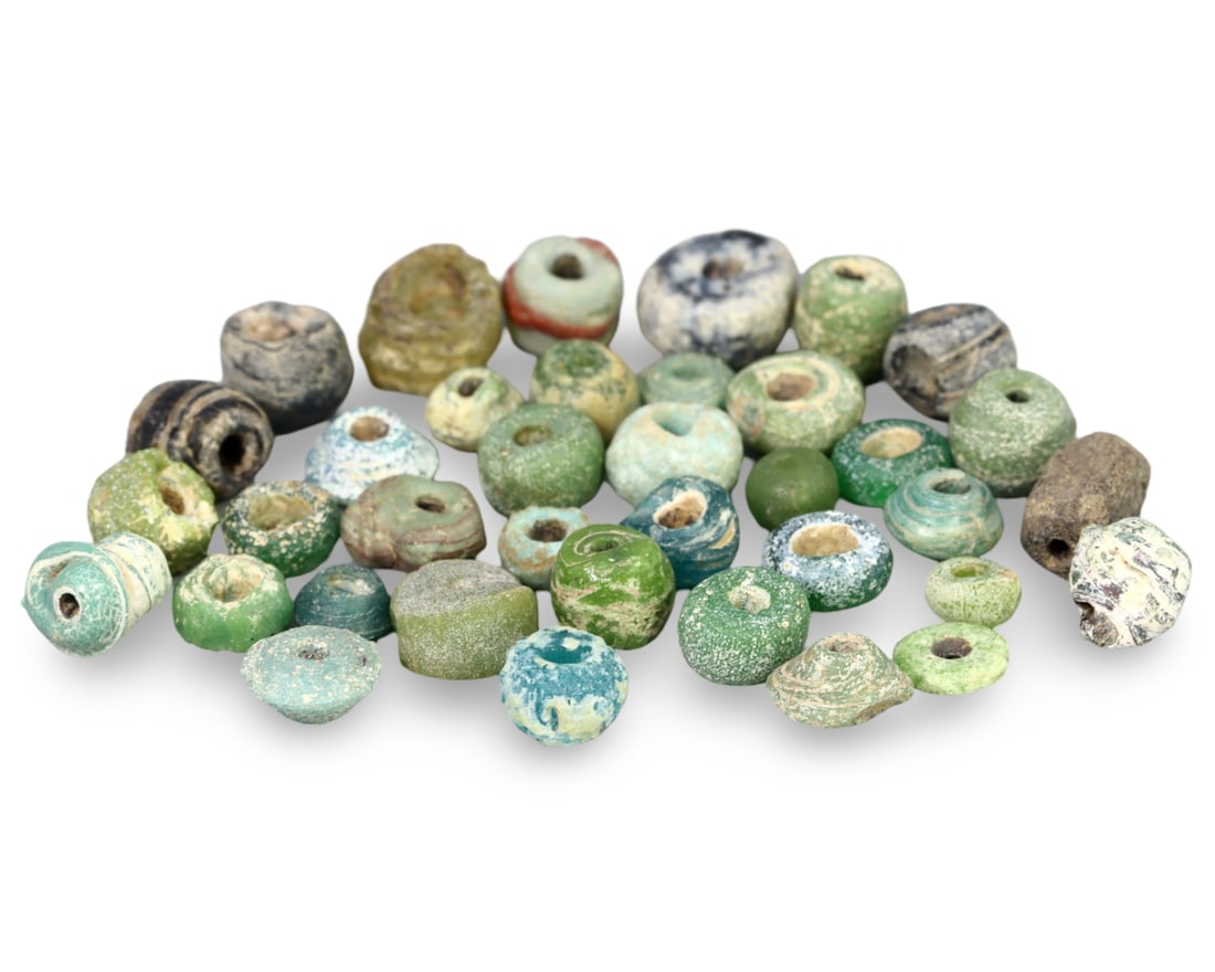 Ancient Egyptian New Kingdom Faience Melon-Seed Beads Collection: NO RESERVE AUCTION running!! Our upcoming No Reserve Auction offers an incredible collection of authentic ancient Roman coins, Viking jewelry, and historical artifacts spanning millennia. This is a ra