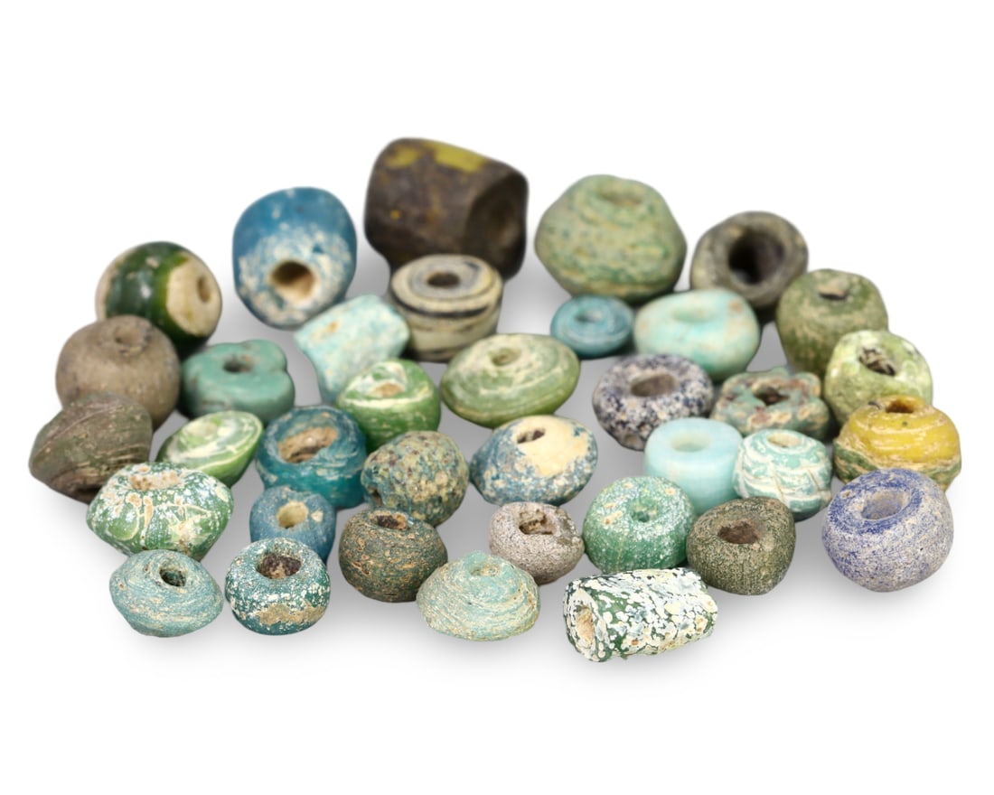 Ancient Egyptian New Kingdom Faience Melon-Seed Beads Collection: NO RESERVE AUCTION running!! Our upcoming No Reserve Auction offers an incredible collection of authentic ancient Roman coins, Viking jewelry, and historical artifacts spanning millennia. This is a ra