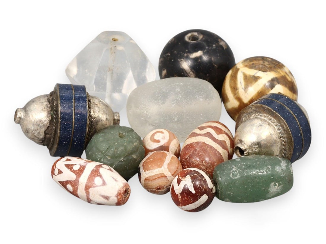 Mixed Collection of Etched Carnelian, Lapis, and Silver Beads, Indus Valley Civilization: Our highly anticipated Antique Auction, "Treasures of the Ancient and Medieval World," offering an unparalleled opportunity for collectors and history enthusiasts to acquire rare Ancient Artifacts for
