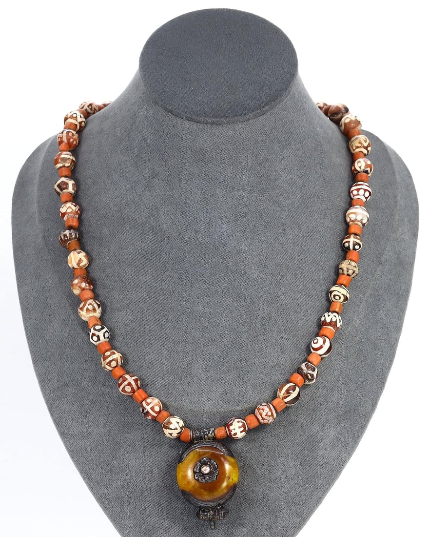 Exquisite Sino-Tibetan Tribal Necklace with Amber Pendant and Etched Carnelian Beads: Our highly anticipated Antique Auction, "Treasures of the Ancient and Medieval World," offering an unparalleled opportunity for collectors and history enthusiasts to acquire rare Ancient Artifacts for