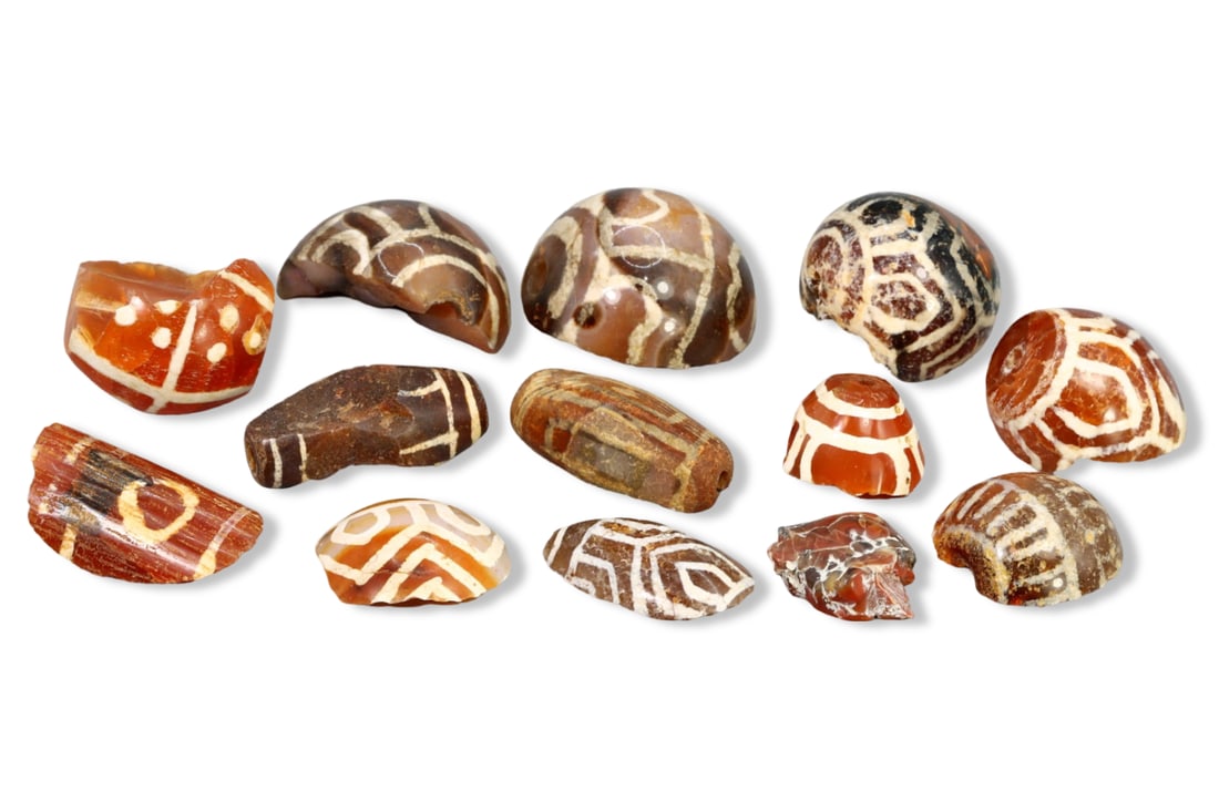 Assortment of Ancient Etched Carnelian and Agate Beads, Indus Valley, 3rd-2nd Millennium BCE: Our highly anticipated Antique Auction, "Treasures of the Ancient and Medieval World," offering an unparalleled opportunity for collectors and history enthusiasts to acquire rare Ancient Artifacts for