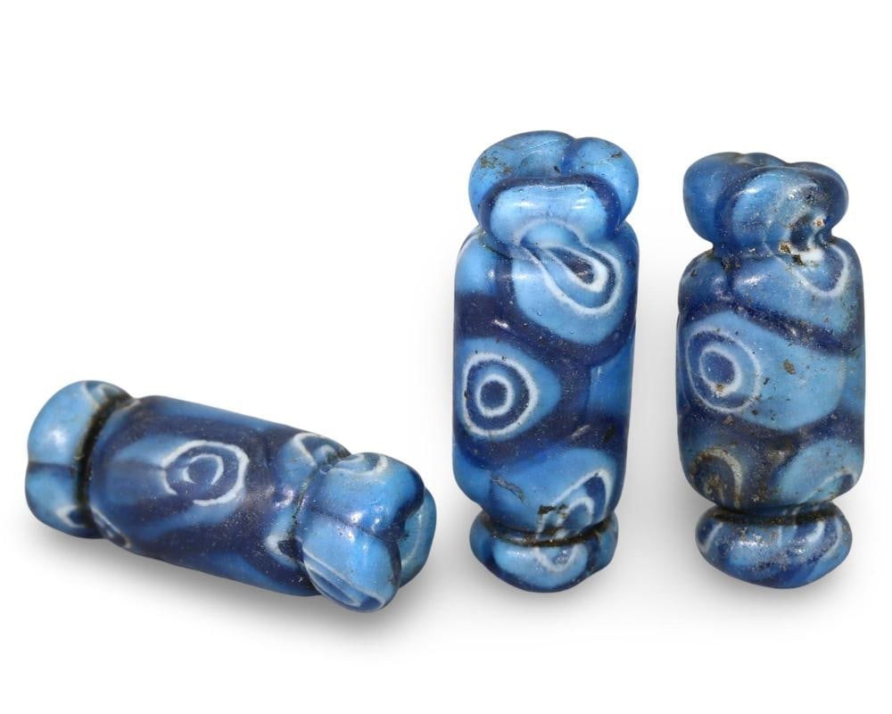 Set of Three Roman Millefiori Glass Beads with Blue and White Eye Motifs: Our highly anticipated Antique Auction, "Treasures of the Ancient and Medieval World," offering an unparalleled opportunity for collectors and history enthusiasts to acquire rare Ancient Artifacts for