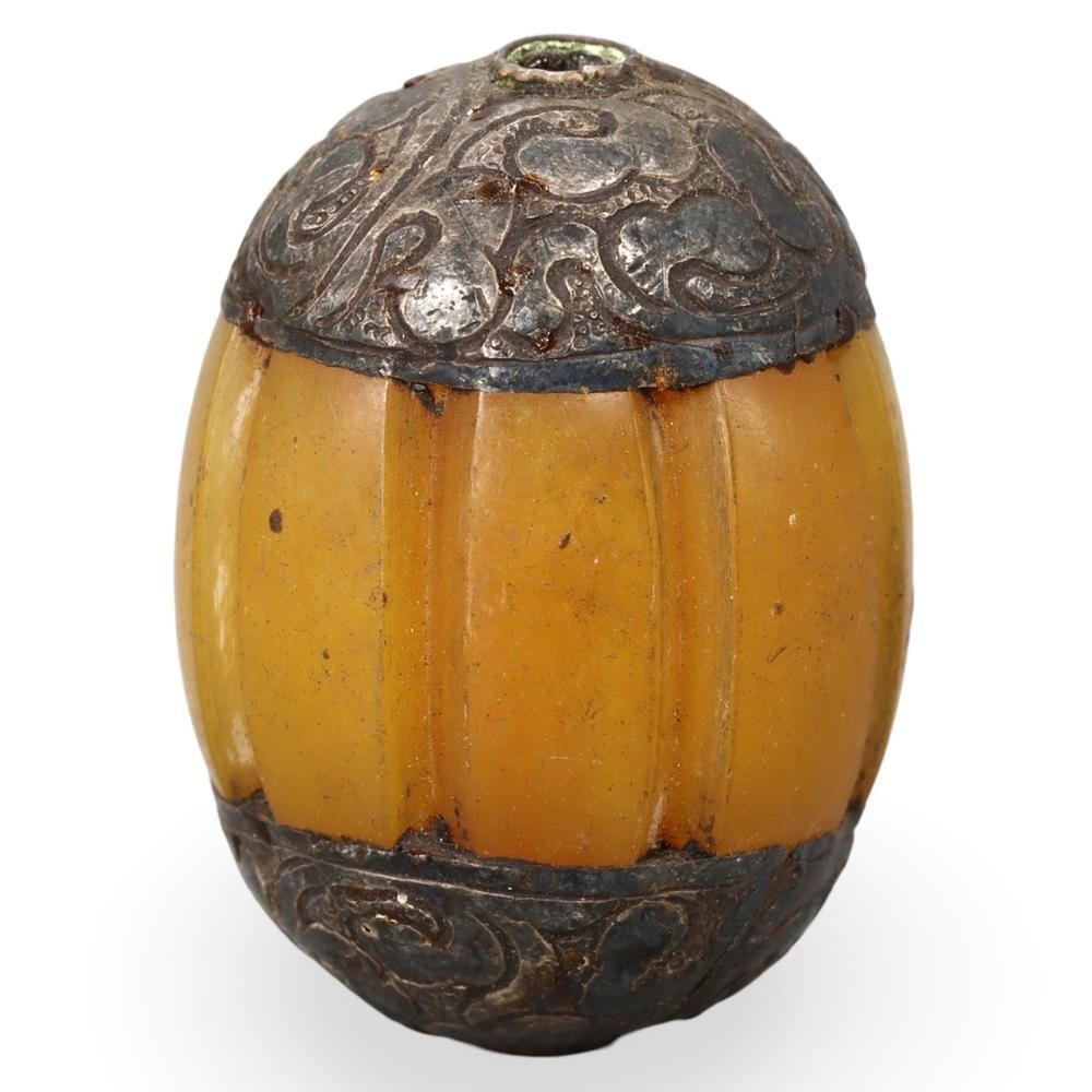 Antique Sino-Tibetan Capped Amber Copal Bead: Our highly anticipated Antique Auction, "Treasures of the Ancient and Medieval World," offering an unparalleled opportunity for collectors and history enthusiasts to acquire rare Ancient Artifacts for