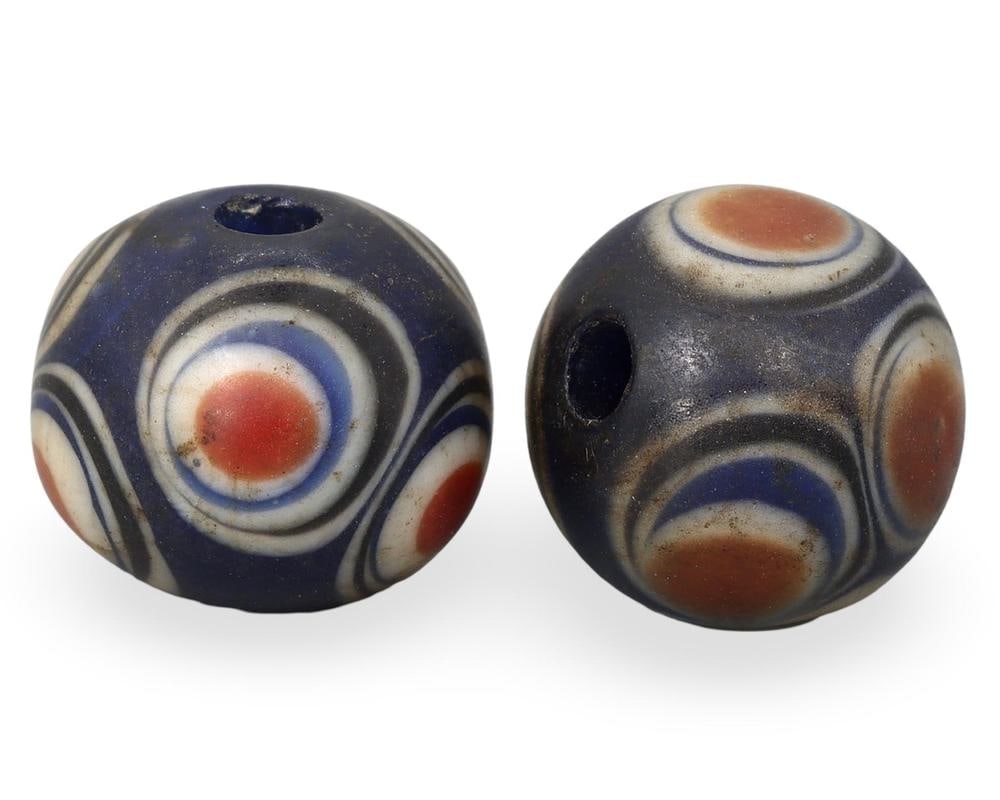 Lot of 2 Antique Mediterranean Eye Pattern Glass Beads: Our highly anticipated Antique Auction, "Treasures of the Ancient and Medieval World," offering an unparalleled opportunity for collectors and history enthusiasts to acquire rare Ancient Artifacts for