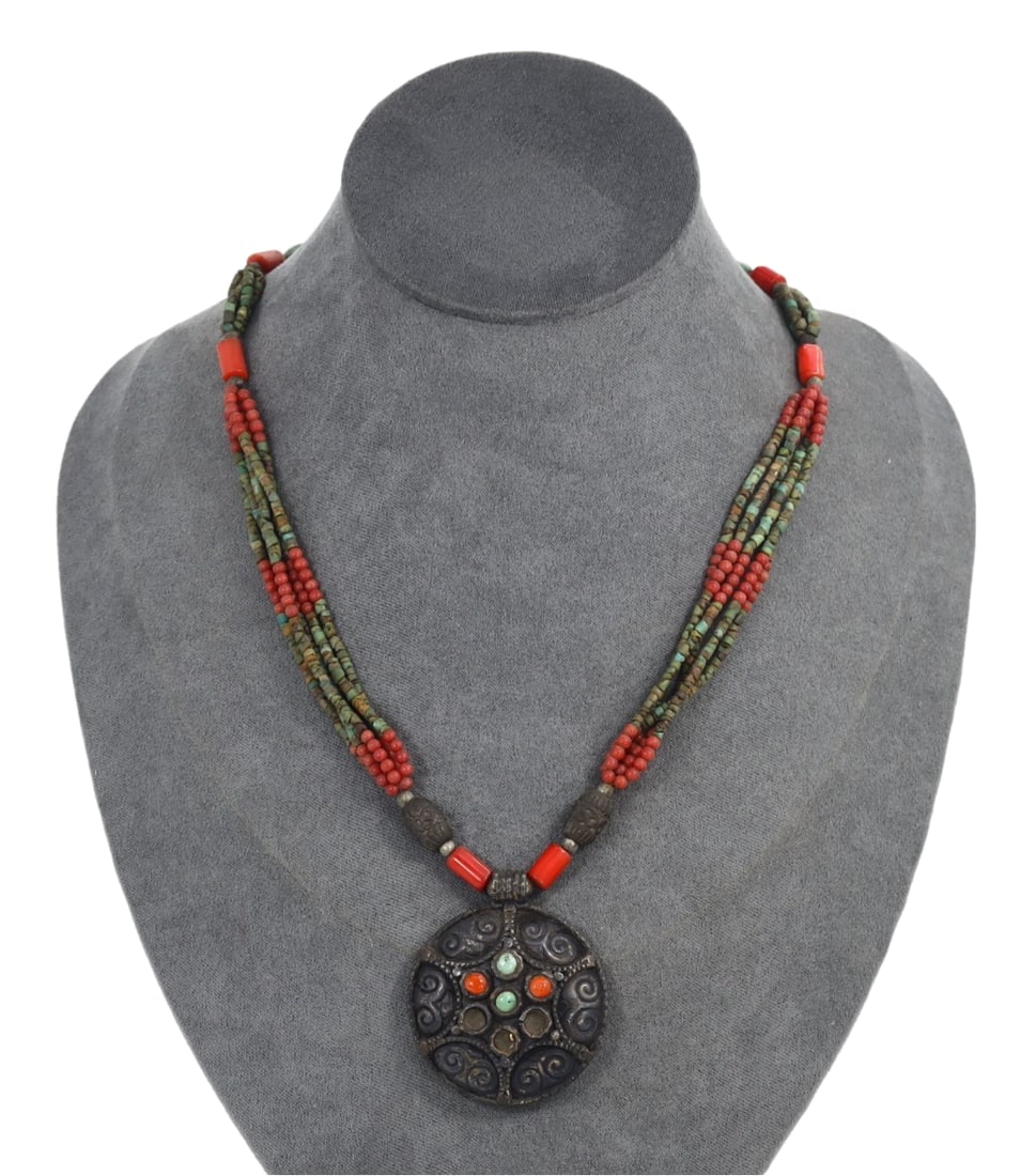 Antique Tibetan Multi-Strand Beaded Necklace with Coral and Turquoise Inlaid Silver Pendant: **Dimension information at the bottom section after Condition** Welcome to the No Reserve Ancient Relics & Rare Artifacts auction, where history comes alive through an extraordinary collection of trea