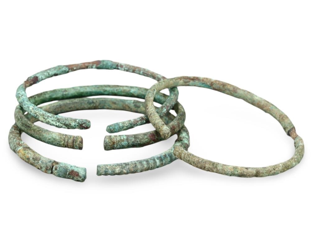 Lot of Ancient Roman Bronze Bracelets Featuring Verdigris Patina: **Dimension information at the bottom section after Condition** Welcome to the No Reserve Ancient Relics & Rare Artifacts auction, where history comes alive through an extraordinary collection of trea