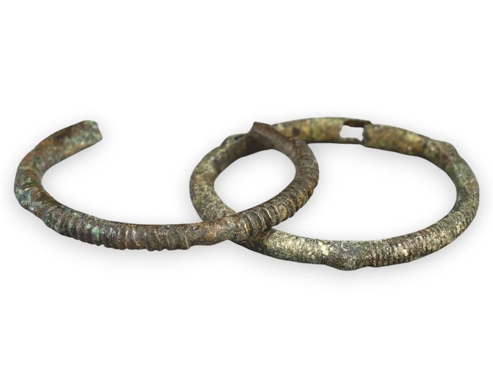 Pair of Ancient Celtic Hallstatt Bronze Armlets with Ribbed Design, Early Iron Age: **Dimension information at the bottom section after Condition** Welcome to the No Reserve Ancient Relics & Rare Artifacts auction, where history comes alive through an extraordinary collection of trea