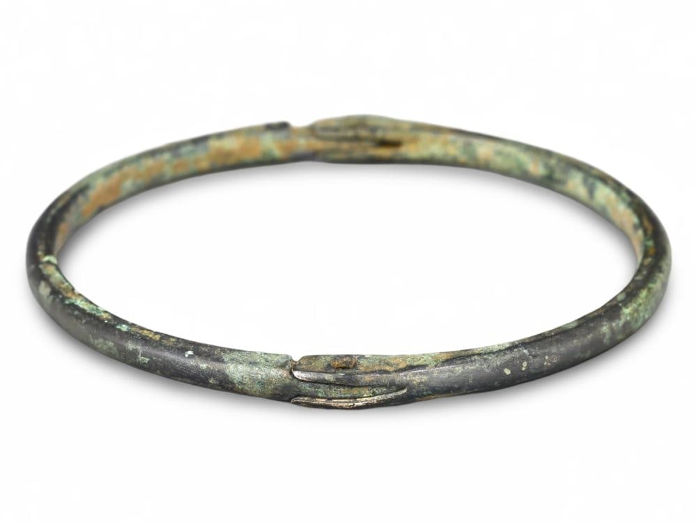 Unique Medieval Viking Bronze Armlet with Natural Verdigris from Northern Europe: **Dimension information at the bottom section after Condition** Welcome to the No Reserve Ancient Relics & Rare Artifacts auction, where history comes alive through an extraordinary collection of trea