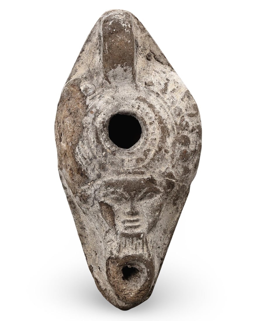 Egyptian-Style Terracotta Oil Lamp with Deity Face, Ancient-Inspired Artifact: **Dimension information at the bottom section after Condition** Welcome to the No Reserve Ancient Relics & Rare Artifacts auction, where history comes alive through an extraordinary collection of trea