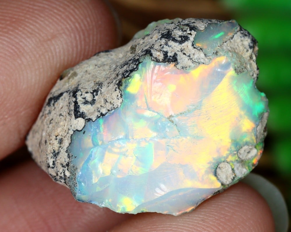 14.2Ct Uncut Ethiopian Welo Opal Rough with Stunning Play of Color Natural Gemstone: **Dimension information at the bottom section after Condition** Welcome to the No Reserve Antique Treasures Auction, where history comes alive through an extraordinary collection of treasures spanning