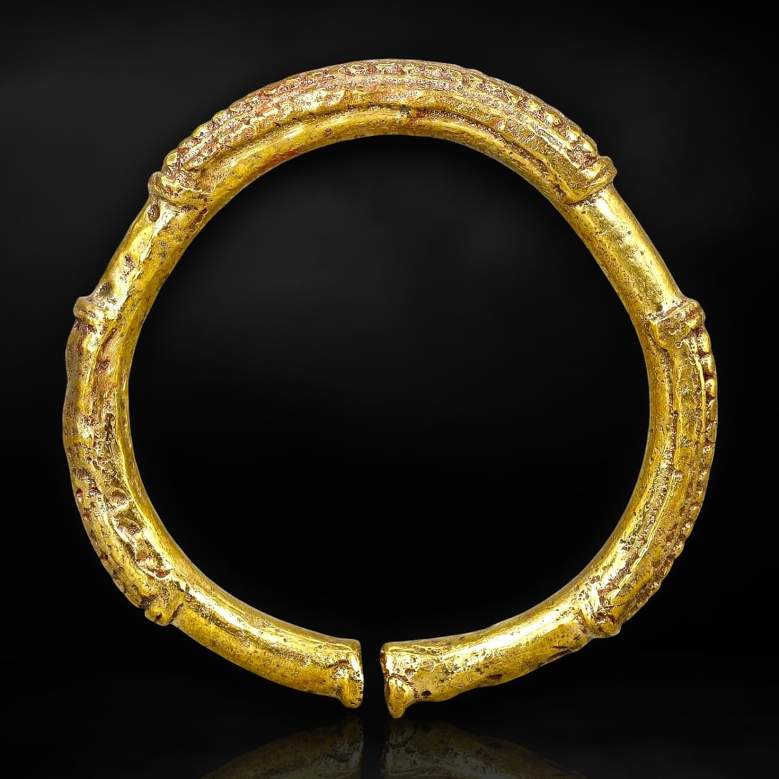 Ancient Gold-Gilt Celtic Torc Bracelet, Western Europe, c. 3rd-1st Century BCE: This exquisite gold-gilt torc bracelet originates from the Celtic tribes of Western Europe, dating back to the La T?ne period, circa 3rd-1st century BCE. The La Tene culture, known for its distinctive