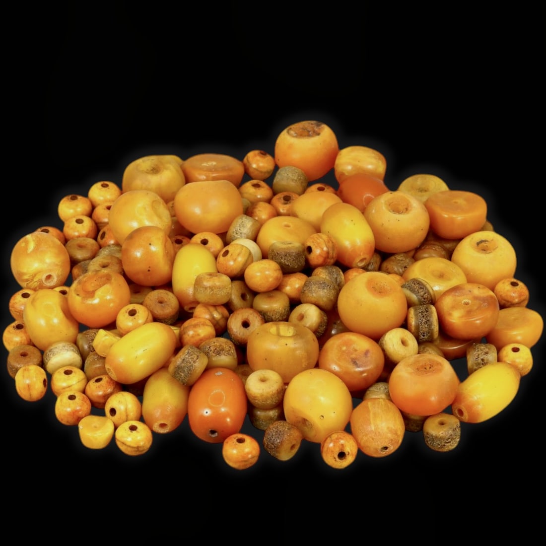 Antique Sino-Tibetan Spiritual Harmony Symbolic Assorted Amber and Copal Prayer Bead Collection, c.: This exquisite collection of assorted amber and copal beads originates from the spiritual heartland of the Ancient Sino-Tibetan region, crafted between the 17th and 18th centuries. These beads, tradit