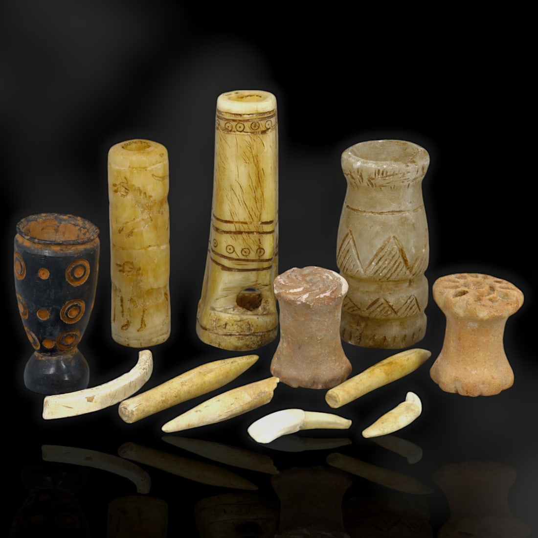 Ancient Mesopotamian Ritual and Symbolic Carvings Artifact, c. 2nd Millennium BCE: This extraordinary set of 12 Mesopotamian artifacts, crafted from materials such as bone, fang, black steatite, clay, and calcite stone, captures the artistic and ritualistic essence of one of the wor