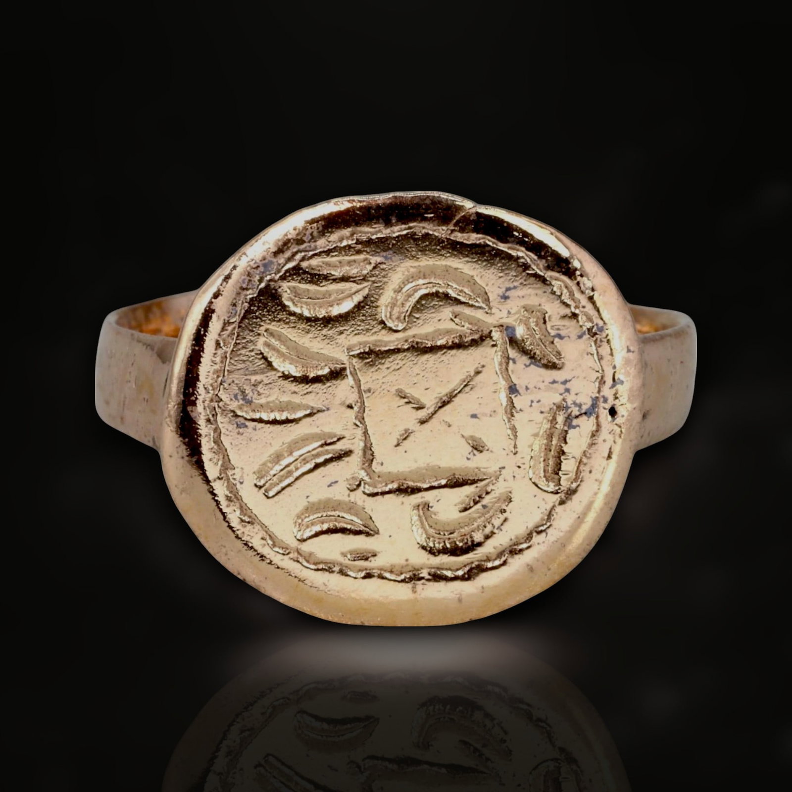 Ancient Byzantine Cross and Laurel Symbolic Pink Gold-Gilded Bronze Ring, c. 6th-8th Century CE: This impressive bronze ring from the Byzantine Empire, dating to the 6th-8th century CE, showcases the elegance and symbolic depth of Byzantine craftsmanship. Refurbished with a refined 24-karat pink 