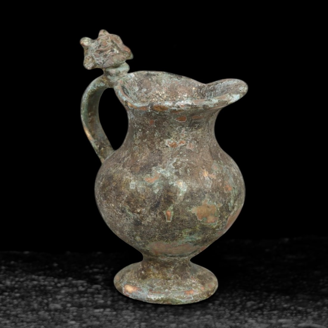 Rare Hellenistic Bronze Oinochoe with Ornamental Lion Finial, c. 3rd Century BCE: This exquisite bronze oinochoe dates to the Hellenistic period, approximately the 3rd century BCE, an era celebrated for its advancement in art and the flourishing of Greek culture across the Mediterr