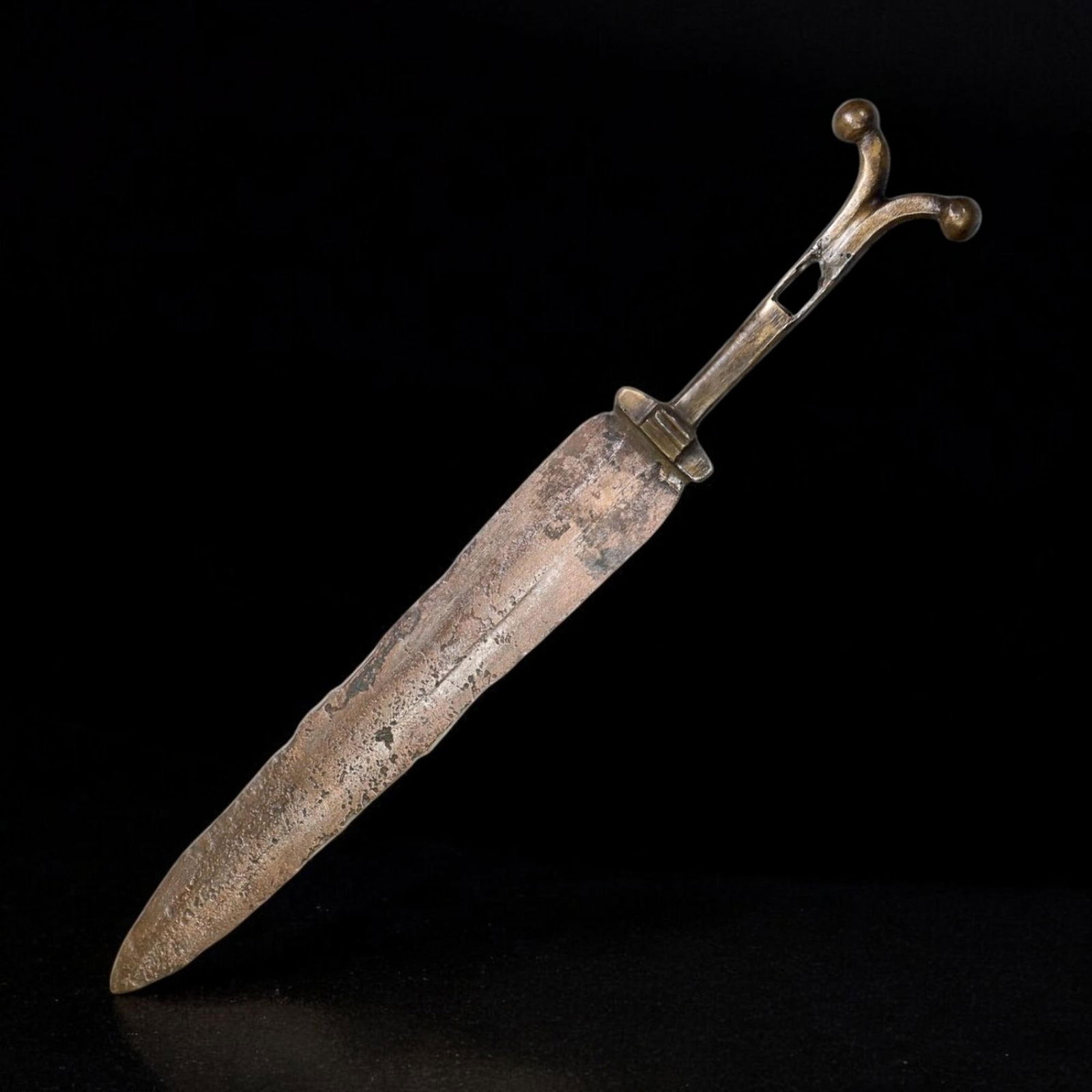 LURISTAN BRONZE DAGGER, WESTERN IRAN, CIRCA 1200-800 BCE (34cm, 254g): This is a fine example of a Luristan bronze dagger or short sword, crafted between 1200-800 BCE during the Late Bronze to Early Iron Age in western Iran. Measuring 34cm in length and weighing 254g, th