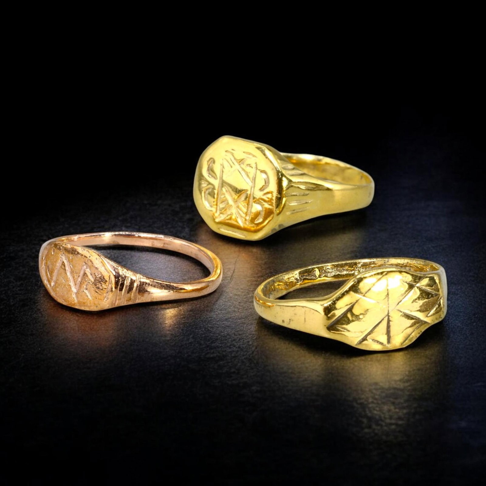 VIKING AGE: Lot of 3 Gold-Gilt Rings, 9th-11th Century CE (8g, 8.25-9.5 US): This lot includes three gold-gilt rings from the Viking Age, dating to the 9th-11th century CE. Sized 8.25-9.5 US, each ring features unique engraved designs with geometric and symbolic patterns, refl
