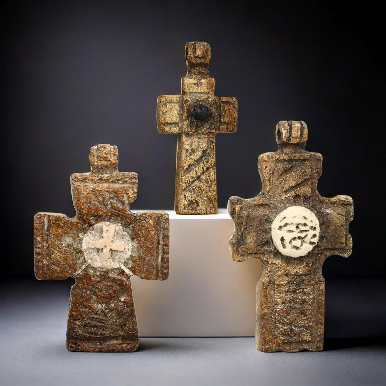 MEDIEVAL ERA: Set of Wooden Crosses, 12th-15th Century: This set of three wooden crosses, varying in size from 5 to 7 cm and weighing a combined 52 g, reflects the craftsmanship and devotional practices of the medieval period. Each cross is uniquely carved