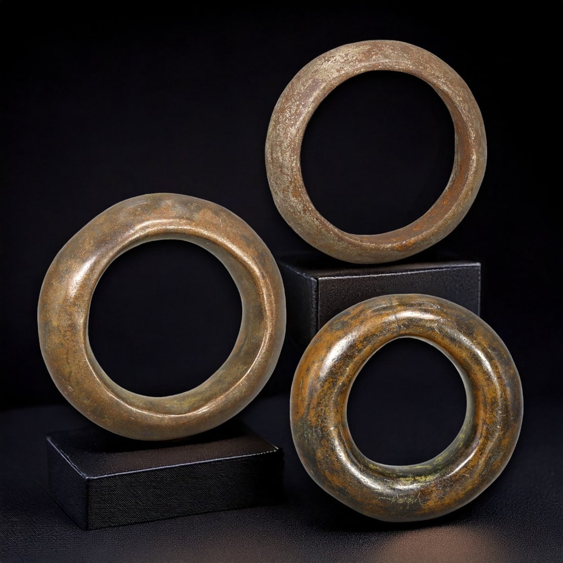 ANCIENT CELTIC: Lot of 3 Bronze Ring Proto-Money, c. 2nd-1st Century BCE: This lot features three bronze rings, measuring between 2 and 2.5 cm in diameter and weighing a combined 95 grams. These rings represent an early form of proto-money used by Celtic tribes before the s