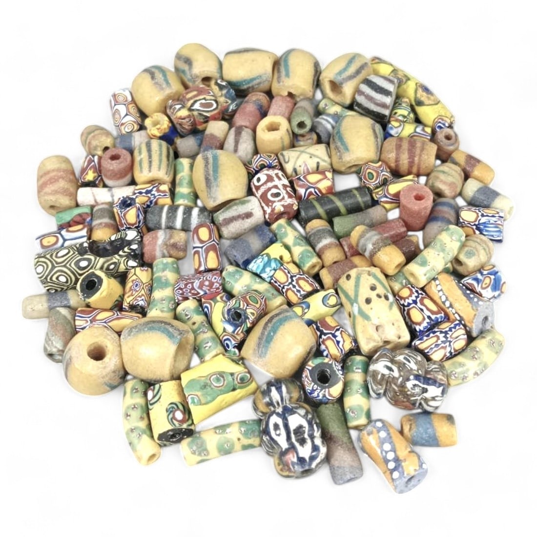 AFRICAN ANTIQUE GLASS AND CLAY TRADE BEADS: Lot of 103, 18th-20th Century CE (244g, 0.5-2cm): This lot includes 103 African antique trade beads, ranging from 0.5 to 2cm in size and weighing a total of 244g. This diverse collection features a variety of materials, including glass and clay, with
