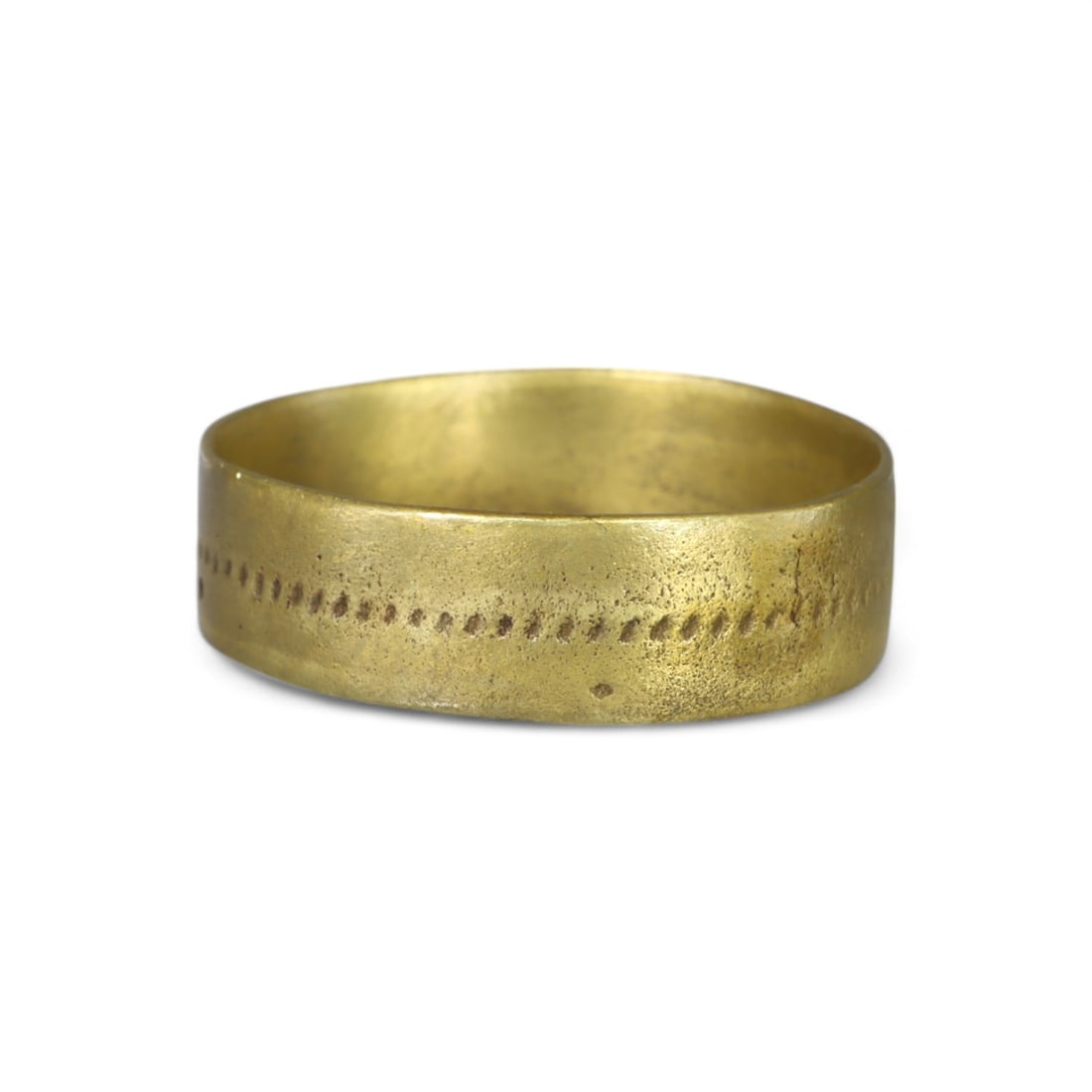 VIKING ERA: Gold-Gilt Bronze Ring, 9th-11th Century AD (2g, Size 7.5 US): This Viking-era gold-gilt bronze ring weighs 2g and is approximately size 7.5 US. Its minimalist yet elegant design features a lightly textured surface with a dotted decorative line encircling the ban