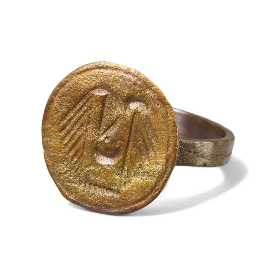 BYZANTINE ERA: Bronze "Eagle Motif" Signet Ring, Circa 6th-9th Century CE (Size 11 US, 5g): This remarkable Byzantine bronze signet ring features a large circular bezel engraved with an eagle motif, symbolizing imperial power and divine authority. The band is robust yet refined, with the pro