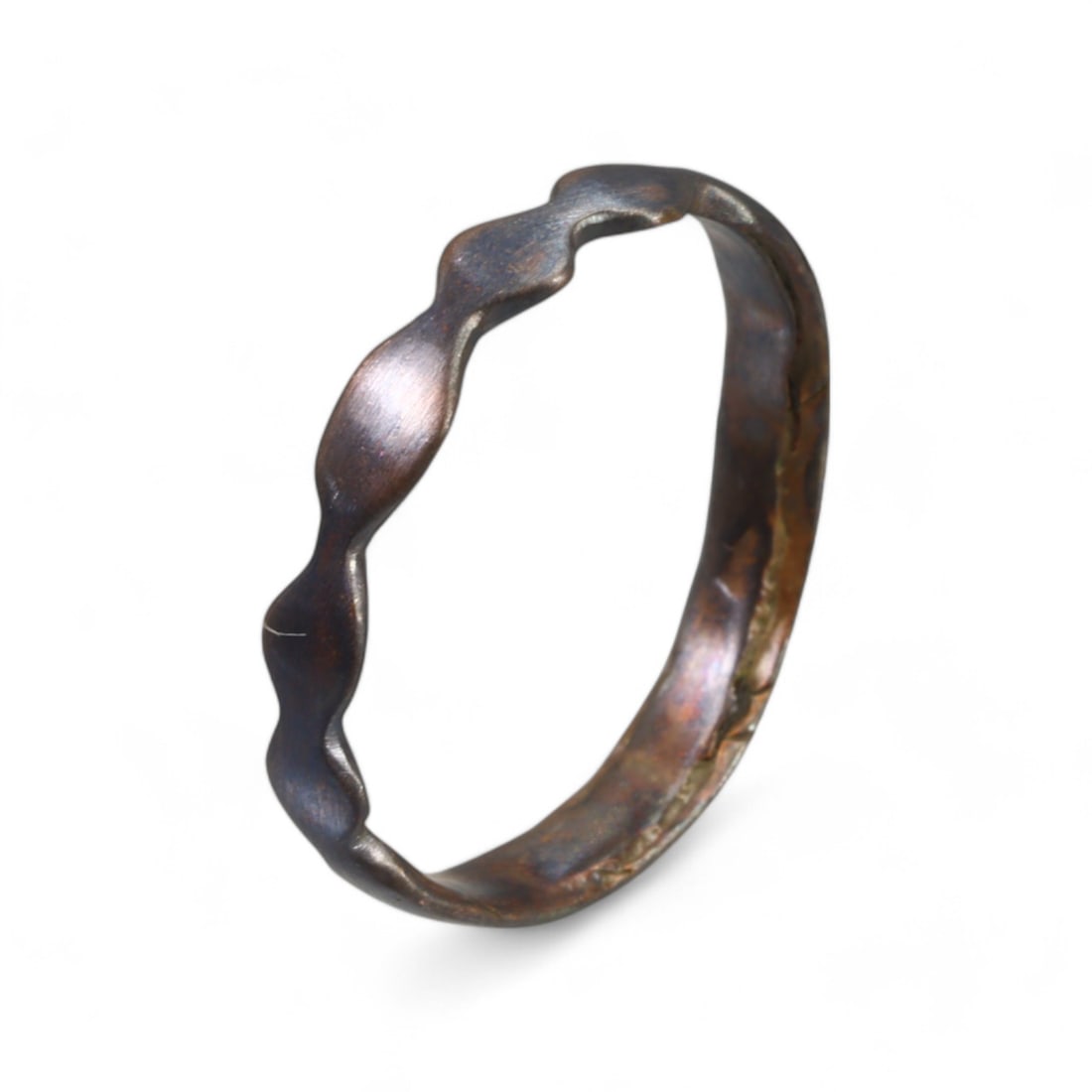 MEDIEVAL ERA: Bronze Ring with Undulating Band Design, 12th-14th Century CE (11 US, 2g): This elegant medieval bronze ring features a unique undulating band design, combining simplicity with subtle artistic flair. The wave-like motif adds texture and dimension, suggesting it may have been