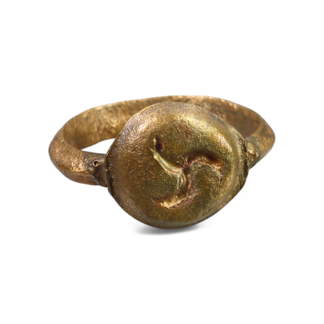 MEDIEVAL ERA: Bronze Signet Ring with Triskelion Symbol, 13th-15th Century CE (9 US, 6g): This impressive Medieval bronze signet ring features a round bezel engraved with a triskelion motif, a design often associated with motion, progress, or cycles of life. The substantial weight and craf