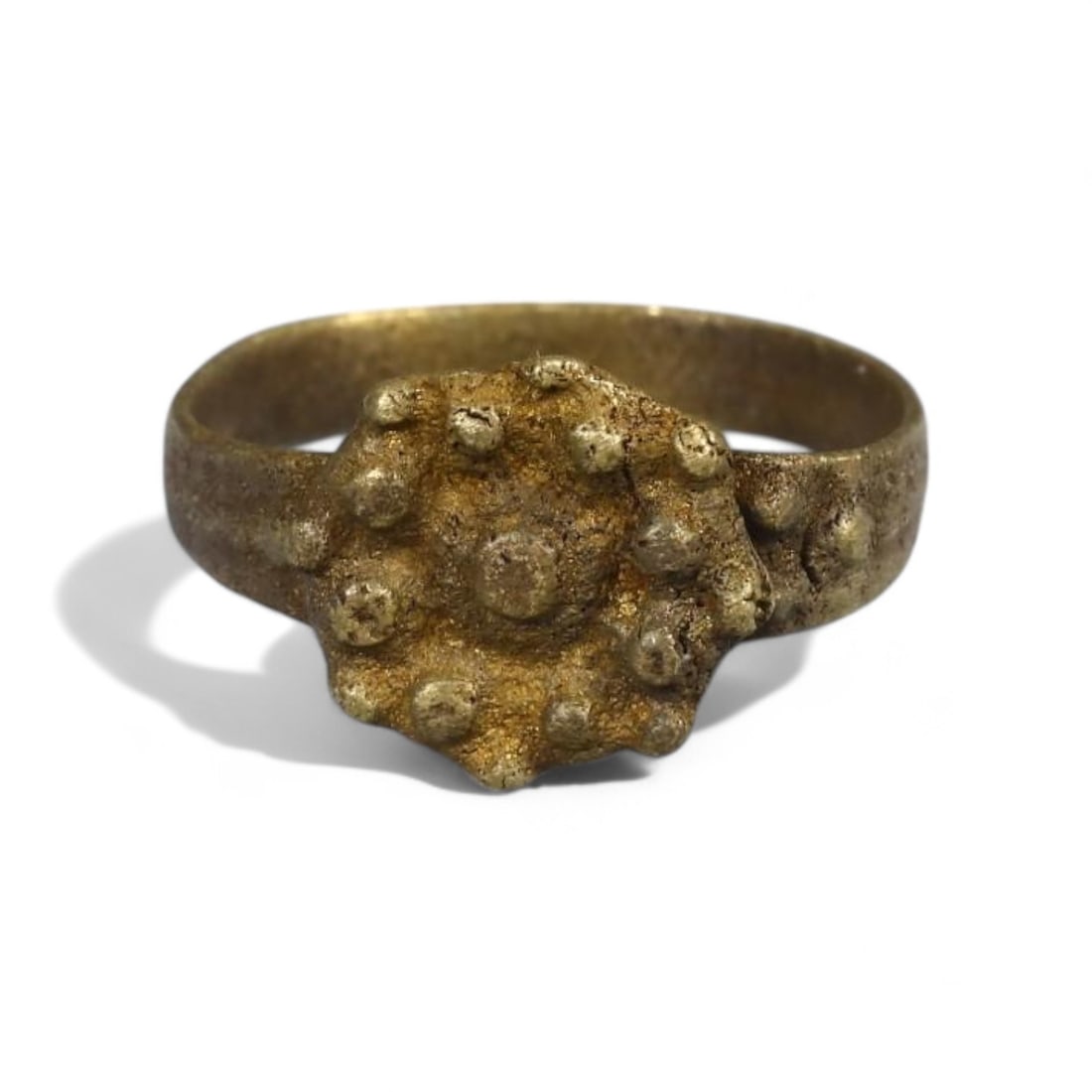 BYZANTINE ERA: Bronze "Sunburst Cluster" Ring, Circa 6th-9th Century CE (Size 6 US, 2g): This delicate Byzantine-era bronze ring features a raised sunburst cluster bezel, symbolizing illumination and divine energy-a central theme in Byzantine art and spirituality. The thin band is underst