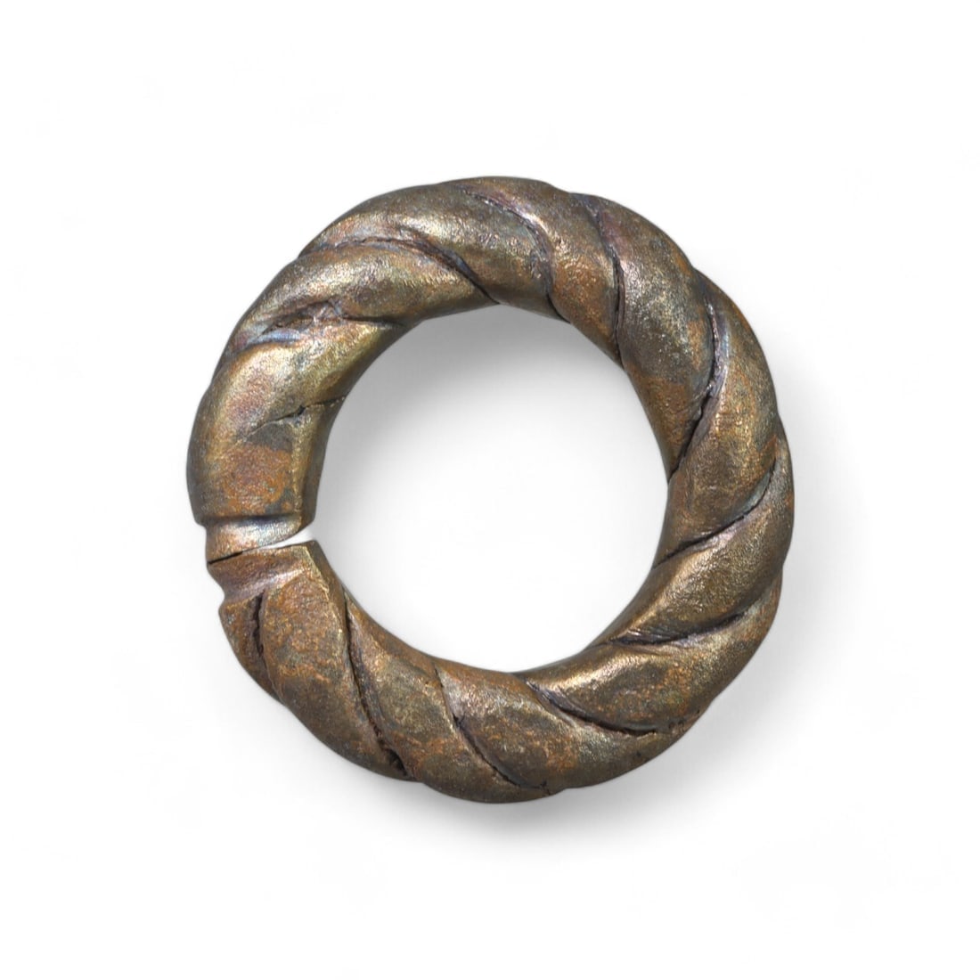 CELTIC: Bronze "Twisted Proto Ring," Circa 1st Millennium BCE (4cm, 42g): This hefty Celtic bronze proto ring showcases a twisted design, characteristic of early European craftsmanship. Such rings served multifunctional purposes, often used as proto-currency or jewelry, ref