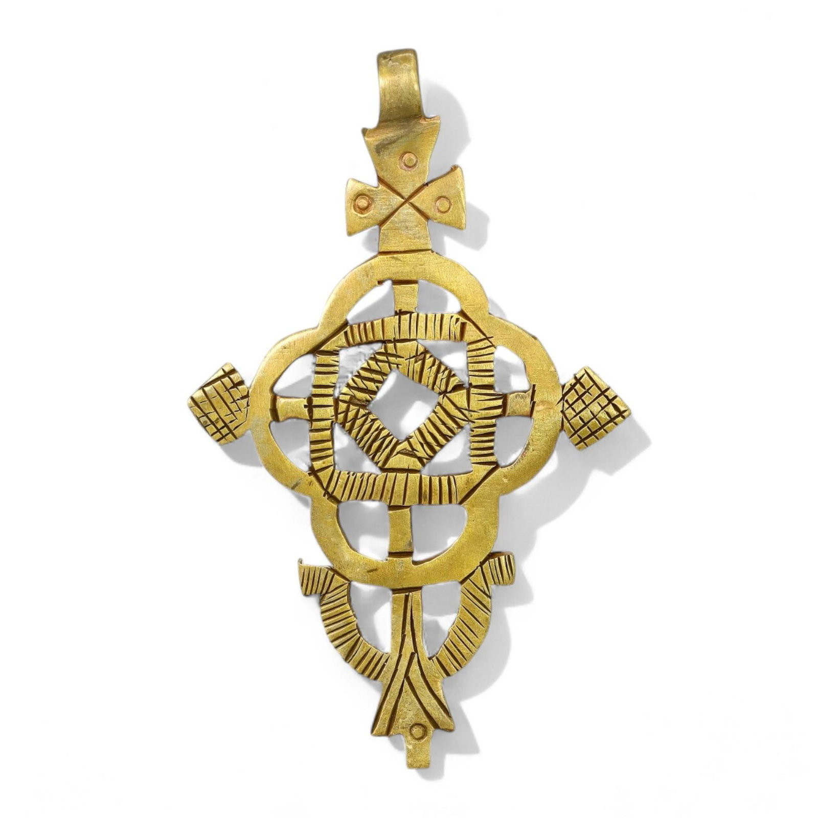 ETHIOPIAN COPTIC ERA: Gilded Bronze Cross Pendant, Circa 17th-19th Century CE (9x5.5cm, 23g): This exquisite Ethiopian Coptic cross pendant is crafted in gilded bronze, featuring intricate geometric engravings and small perforations that enhance its symbolic significance. The cross's symmetric