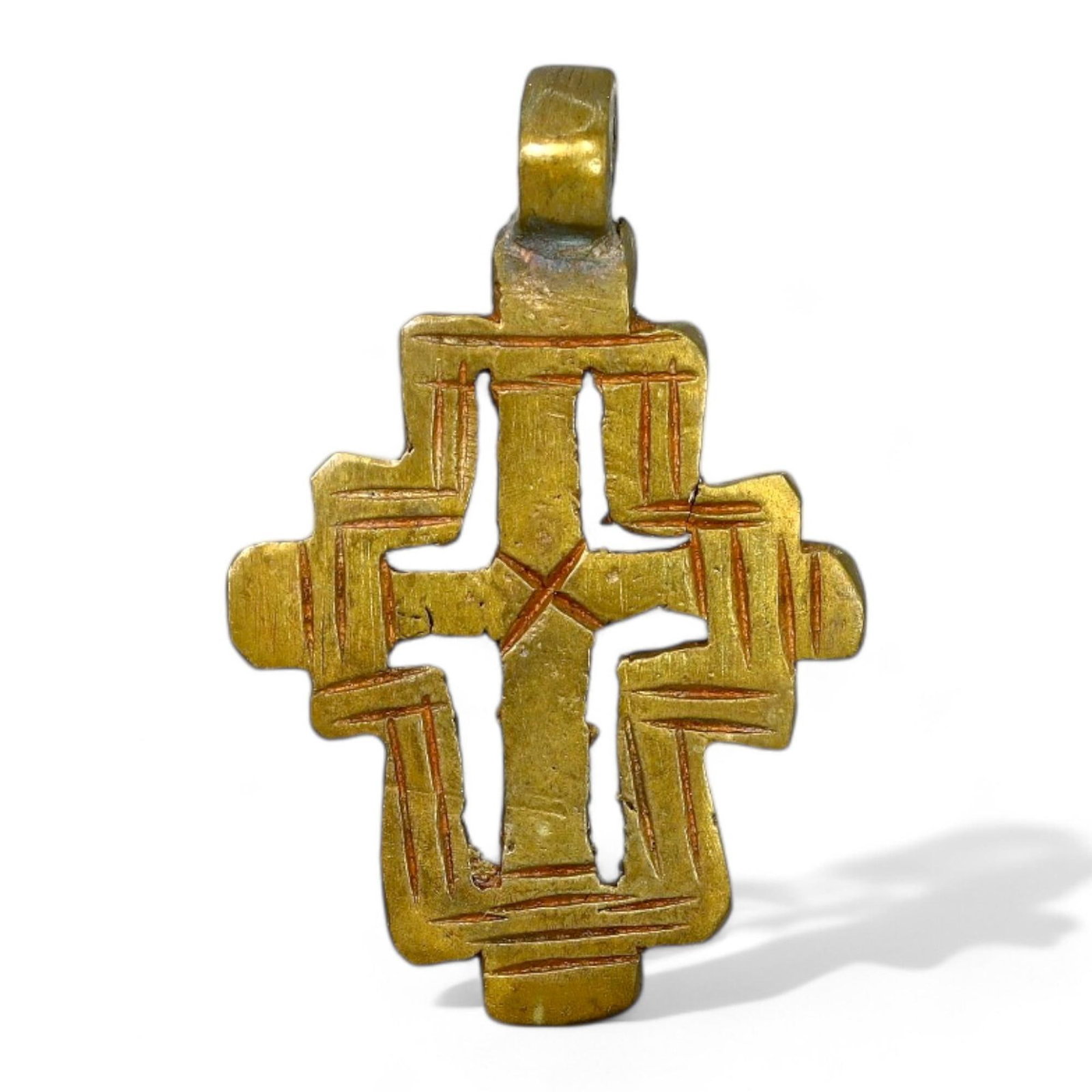 ETHIOPIAN COPTIC ERA: Gilded Bronze Cross Pendant, Circa 17th-19th Century CE (4 x 2.5 cm, 9 g): This exquisite Ethiopian Coptic cross pendant is crafted in gilded bronze, featuring intricate geometric engravings and small perforations that enhance its symbolic significance. The cross's symmetric