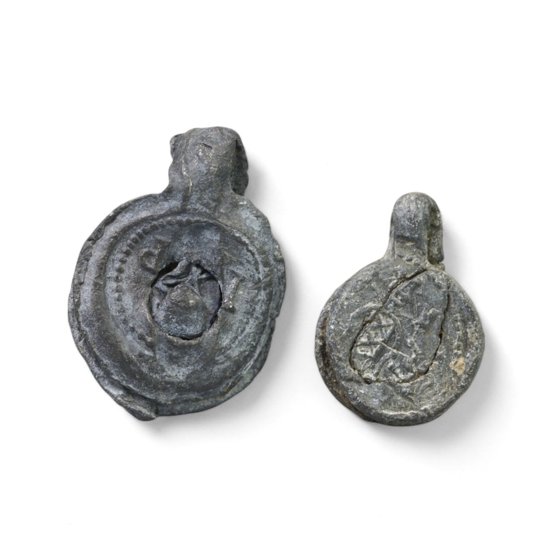 MEDIEVAL CRUSADER ERA: Pair of Lead Pilgrim Badges, 12th-15th Century AD (12.8g, 15-20mm): This lot comprises two lead pilgrim badges from the medieval Crusader period, weighing a combined 12.8g and measuring 15-20mm each. These small yet significant artifacts were issued to pilgrims visiti